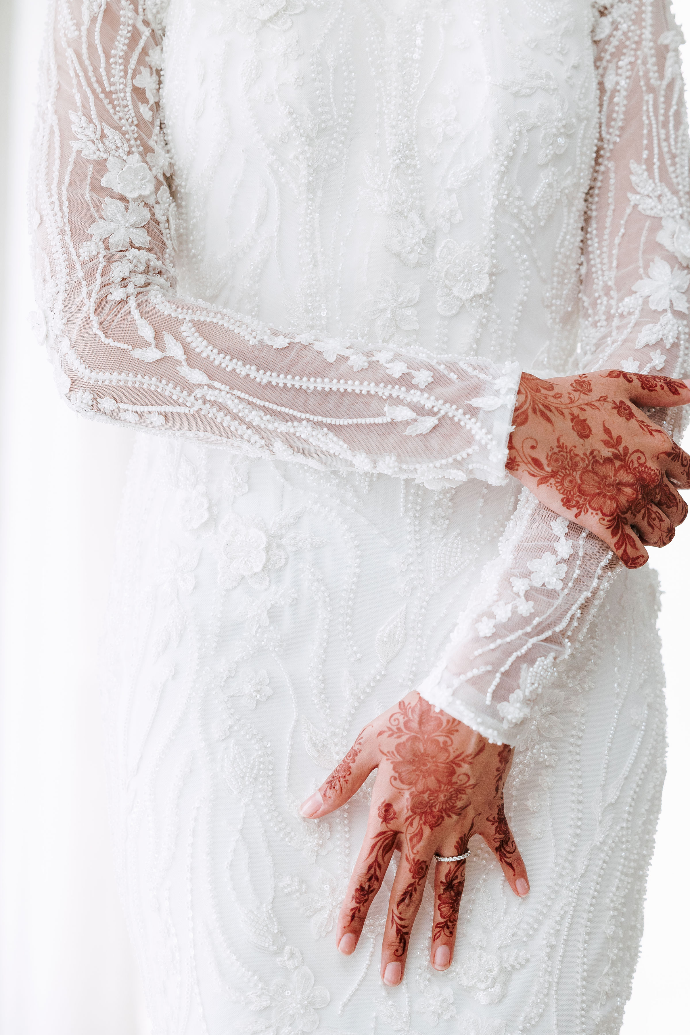 Henna and beaded lace bridal dress detail
