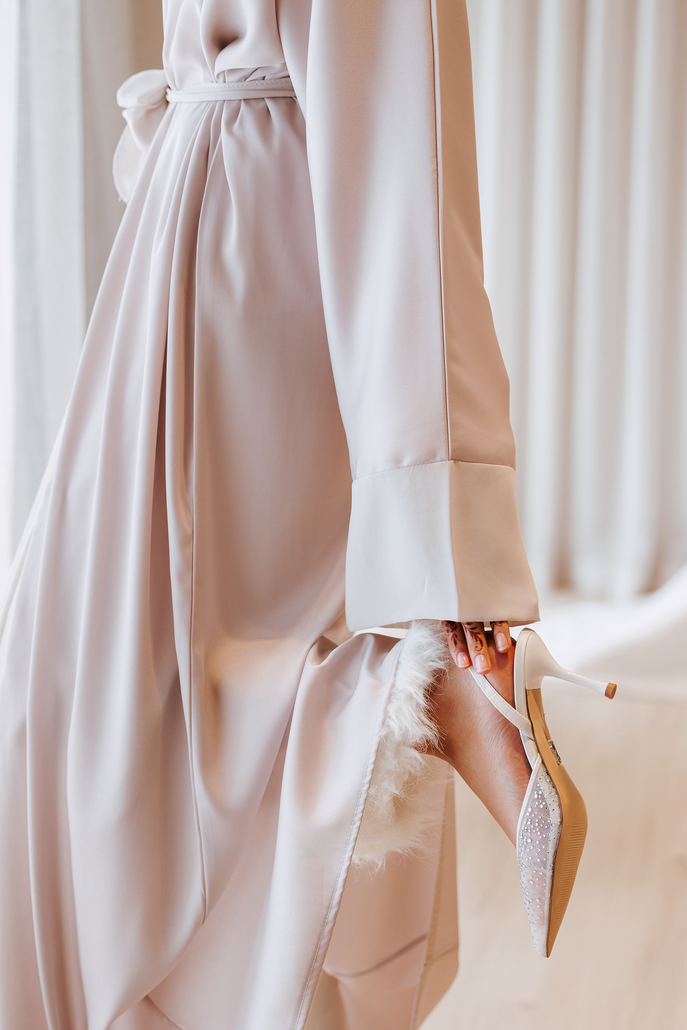 Bridal gown and crystal heels detail